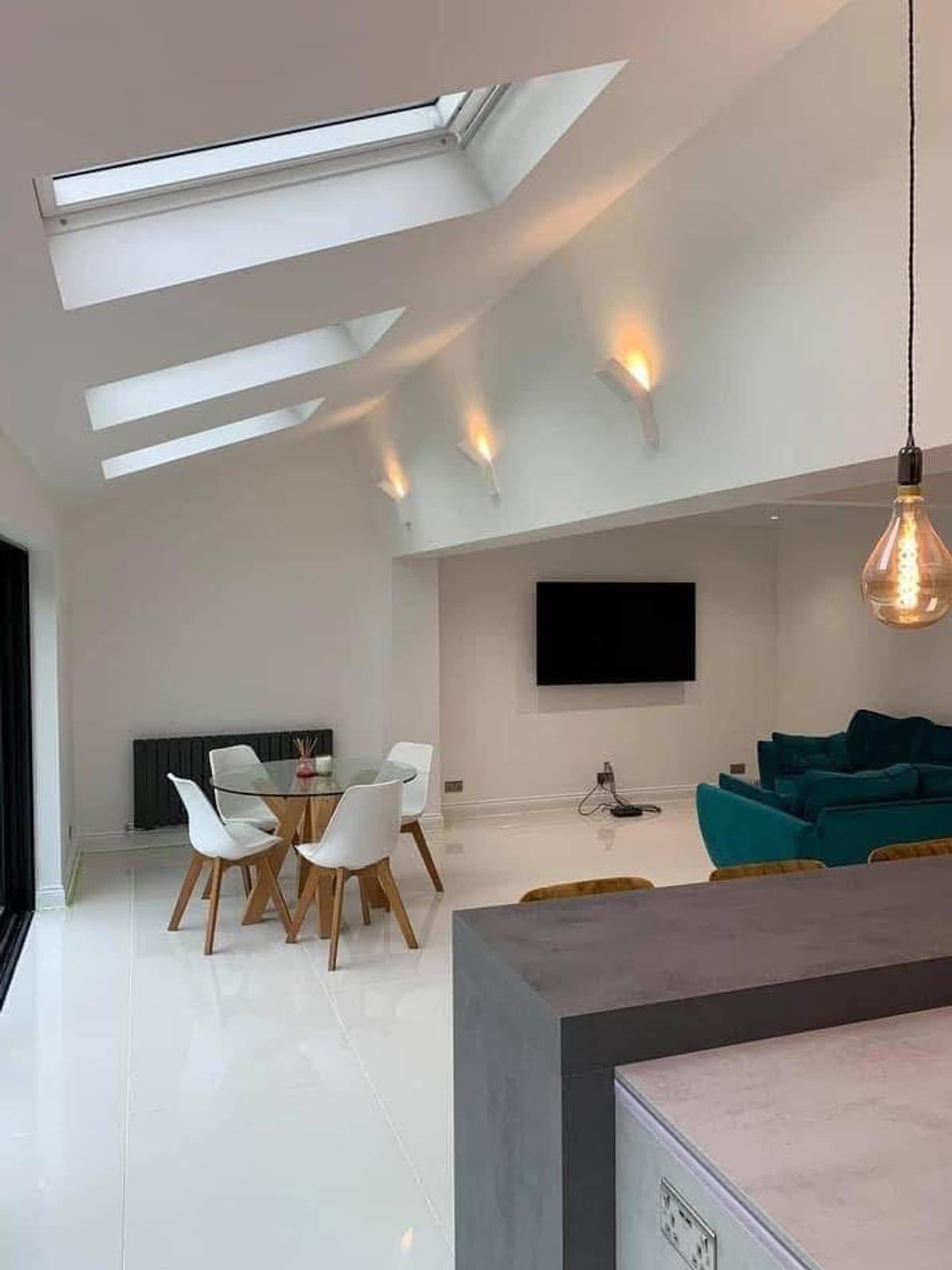 The same space finished, with the vaulted ceiling and reveals cut in by hand